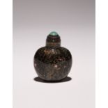 A CHINESE GLASS OVOID SNUFF BOTTLE 18TH CENTURY With a black ground suffused with minute gold