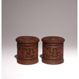 A PAIR OF INDIAN SANDALWOOD CYLINDRICAL BOXES AND COVERS LATE 19TH CENTURY Each cover carved with