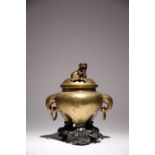 A CHINESE BRASS TRIPOD INCENSE BURNER AND COVER LATE QING DYNASTY The body engraved with a water-