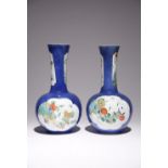 A NEAR PAIR OF CHINESE POWDER-BLUE GROUND BOTTLE VASES KANGXI 1662-1722 Each with a globular body