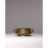 A CHINESE GILT-BRONZE INCENSE BURNER 17TH/18TH CENTURY The compressed globular body raised on a