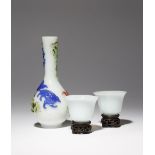 A CHINESE THREE-COLOUR OVERLAY GLASS BOTTLE VASE AND A PAIR OF WHITE GLASS WINE CUPS QING DYNASTY