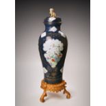 A MASSIVE CHINESE FAMILLE ROSE BLUE-GROUND BALUSTER VASE AND COVER 18TH CENTURY Painted with