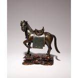 A CHINESE BRONZE AND TURQUOISE INSET INCENSE BURNER MODELLED AS A STALLION LATE QING DYNASTY