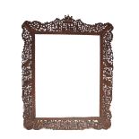 A CHINESE RETICULATED HARDWOOD FRAME 19TH CENTURY Elaborately carved with many small figures,