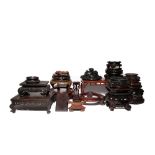 A COLLECTION OF CHINESE WOOD STANDS AND A COVER 19TH AND 20TH CENTURY Of various shapes and sizes,