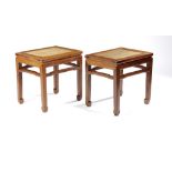 A PAIR OF CHINESE HARDWOOD STOOLS LATE QING DYNASTY The seats enclosed within rectangular frames,