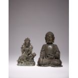TWO CHINESE BRONZE FIGURES OF BUDDHA AND A MANJUSRI LATE MING DYNASTY The Buddha seated in
