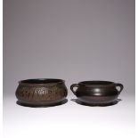 TWO CHINESE BRONZE INCENSE BURNERS QING DYNASTY OR LATER The larger cast with two cartouches