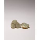 TWO CHINESE CELADON JADE LOTUS SEED PODS QING DYNASTY OR LATER One formed with three seed heads