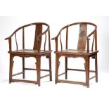 A PAIR OF CHINESE HORSESHOE BACK ARMCHAIRS, QUANYI LATE QING DYNASTY Probably in elm, with curved