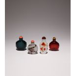 FOUR CHINESE GLASS SNUFF BOTTLES 19TH CENTURY One in ruby coloured glass, another intense viridian