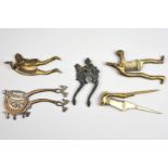 Five Indian betel nut cutters brass and steel, including a Tamil Nadu reclining female figure, 17.