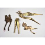 Four Indian betel nut cutters brass and steel, including a Tamil equestrian, 15.5cm long, a