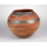 A Venda globular jar South Africa pottery with incised linear and red and black decoration, 28.5cm