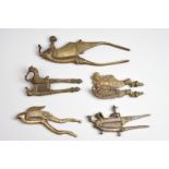 Five Indian betel nut cutters brass and steel, including a hamsa, mythological goose and elephant,