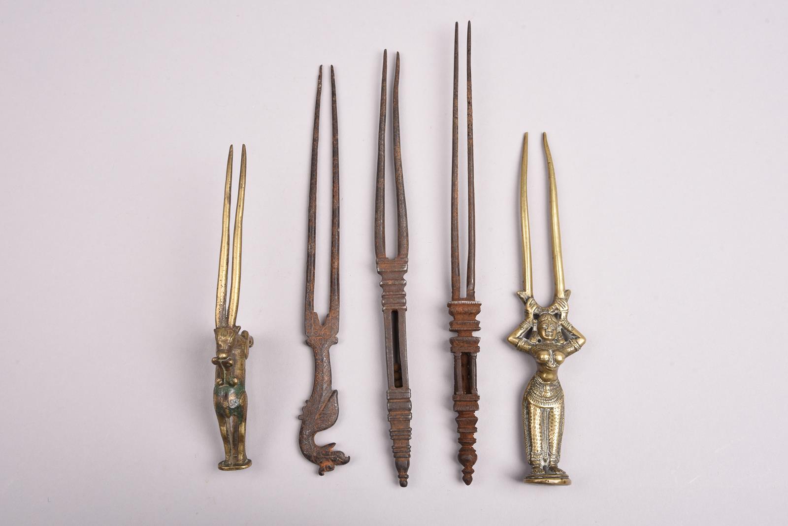 Five Indian hairpins brass and steel, all with two prongs, including a standing female figure, a - Image 2 of 4