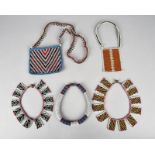 Five South African beaded pieces including a four neckpieces and a bag, the bag 14cm wide. (5)