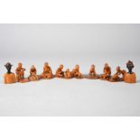 A. Orisadipe, 20th century Lagos, Nigeria Eight miniature carved figural groups of women and