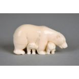 λAn Inuit model Polar bear standing over two cubs Arctic, 20th century walrus ivory, 8.2cm long,