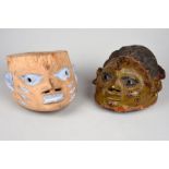 Two Yoruba gelede masks Nigeria with painted decoration, 27.5cm and 30cm long. (2)