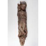 An Indian figural corbel mount 19th century carved as a standing male wearing a turban, a jacket,