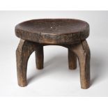 A Hehe stool Tanzania with a dished seat having stamped dot and star motifs to the edges, 24cm