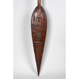 A Duala paddle Cameroon the blade with low relief carving of animals, padlocks, keys, scissors,