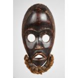 A Dan mask Ivory Coast with an applied hair beard, 24.5cm high. Provenance Ex San Francisco Arts