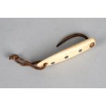 λAn Inuit fish hook Bering Sea walrus ivory, copper nail and lead insets, the top pierced for