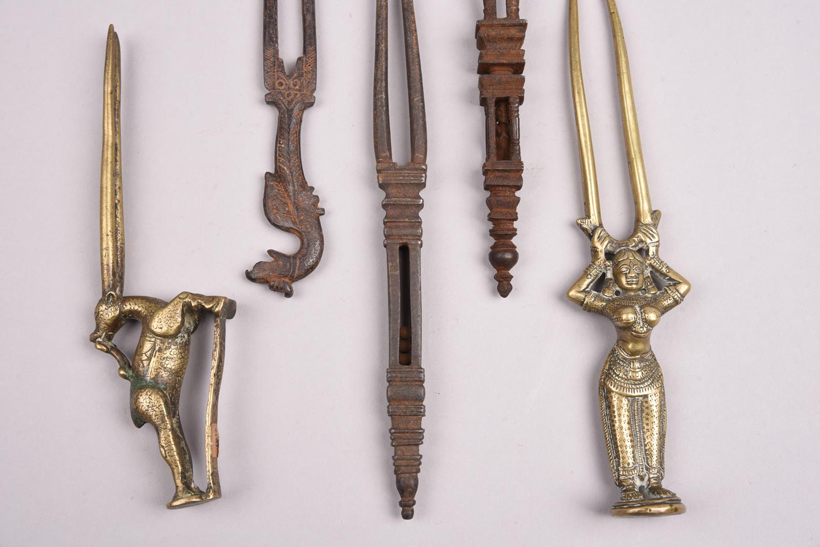 Five Indian hairpins brass and steel, all with two prongs, including a standing female figure, a - Image 4 of 4