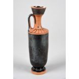 An Attic black glazed lekythos circa 5th century BC with radiating dashes to the shoulders, one side