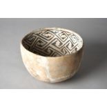 A Mimbres black on white bowl South West, North America pottery with a wide band of geometric