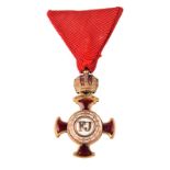 Austria-Hungary: Cross of Merit in Gold with Crown, Franz Joseph I, gilt-bronze cross with red
