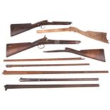 A quantity of antique gun parts, including stocks, barrels, locks and other components.