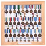 A collection of twenty-seven United Nations Service Medals, with ribbons for a wide variety of UN