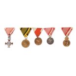 Austria: a small collection of cased medals: i) a set of three medals cased together by Moritz