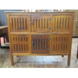 An old English oak food/dole cupboard, the front elevation enclosed by six pierced panels