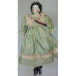Early glazed china shoulder-head doll, German circa 1890, with finely painted blue eyes, red line to