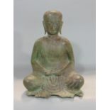Unusual Chinese patinated hollow bronze study of a seated Buddhistic deighty, 27 cm high