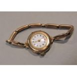 1920s 9ct lug watch, enamelled dial with gilt beaded decoration and Arabic numerals, jewelled