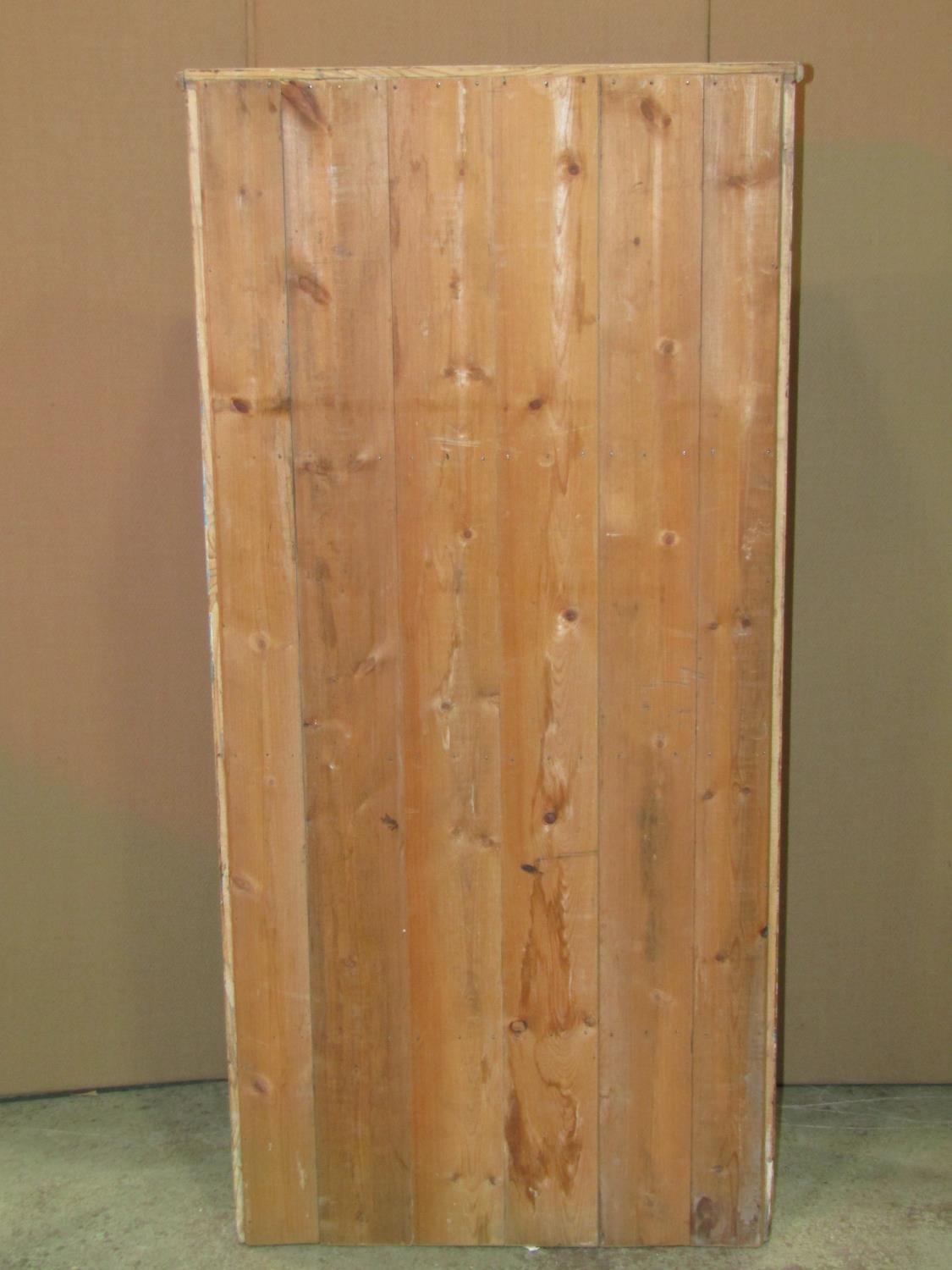 A stripped pine floorstanding shelf unit with three fixed sloping shelves, 63 cm wide x 28 cm x - Image 2 of 2