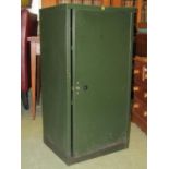 A Helmsman green painted light steel cabinet enclosed by a single full length door with two