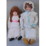 2 early 20th century dolls both with bisque socket heads and jointed composition bodies wearing