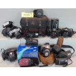 An assortment of Olympus 35mm manual SLR cameras and other Olympus products to include an XA (boxed)