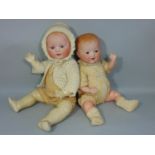 2 bisque heads baby dolls both with 5 piece composition bent limb bodies; smaller doll is by