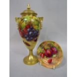 A Royal Worcester Blush Ivory urn shaped vase and cover with painted grape, strawberry and