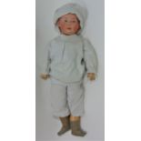 Gebruder Heubach bisque head boy doll with moulded hair, fixed intaglio eyes with highlight spot,