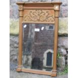 A small Regency style pier glass with rectangular bevelled edge plate housed within a gilt frame