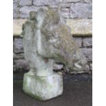A weathered cast composition stone finial / pier cap in the form of a horse's head 61cm high